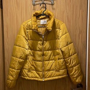 Yellow puffer jacket from Fashion Nova